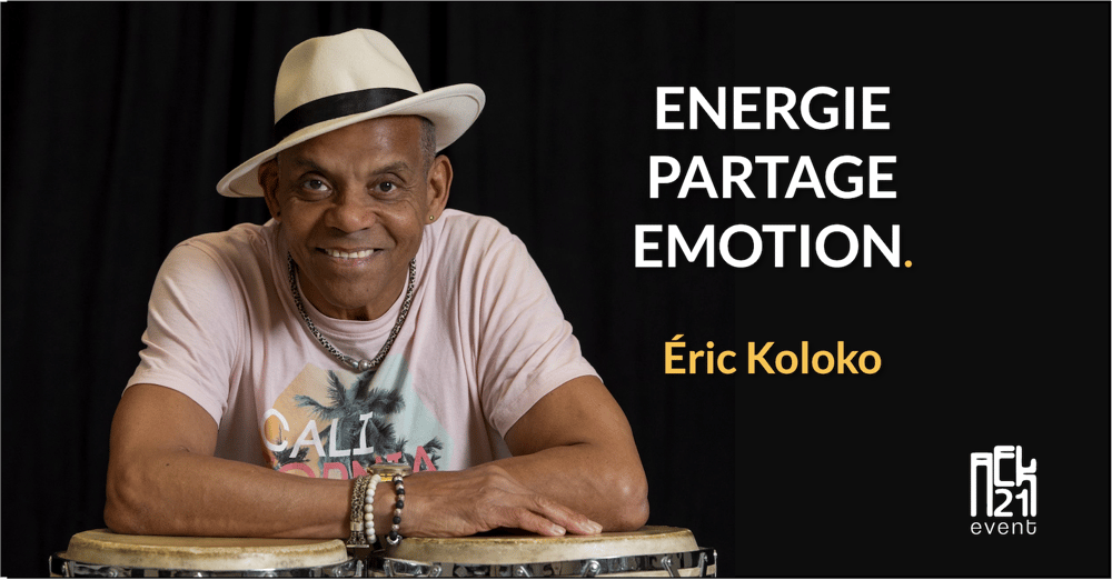 Portrait d’Éric Koloko souriant derrière ses percussions, symbolisant l’énergie, le partage et l’émotion au cœur du spectacle – AEK21 Event.
